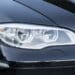 Close up of black car headlight