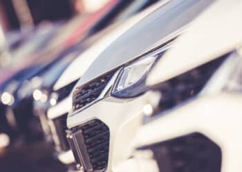 Close up of the front end of cars on a dealership lot