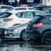 Row of used cars in the rain