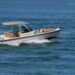 Two people taking a leisurely afternoon cruise in an open sports fishing boat