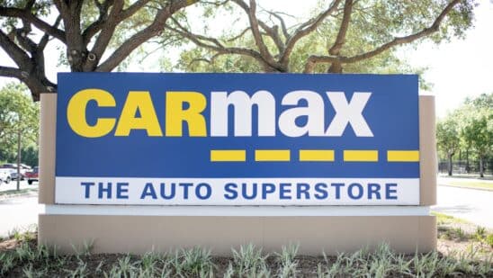 A sign for a CarMax dealership in Houston, TexasA sign for a CarMax dealership in Houston, Texas