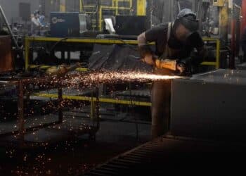 A worker welds a safe that is being manufactured in Payson, Utah.