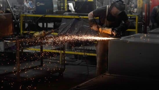 A worker welds a safe that is being manufactured in Payson, Utah.