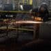 A worker welds a safe that is being manufactured in Payson, Utah.