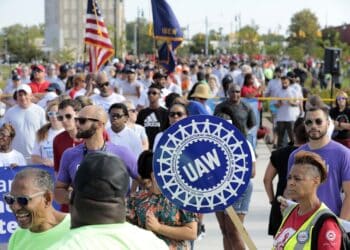 United Auto Workers (UAW) members and supporters march during a Labor Day parade in Detroit, Michigan, US