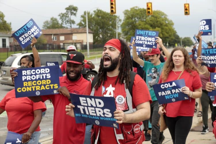 Demonstrators during a UAW practice picket outside the Stellantis Mack Assembly Plant in Detroit on Aug. 23.