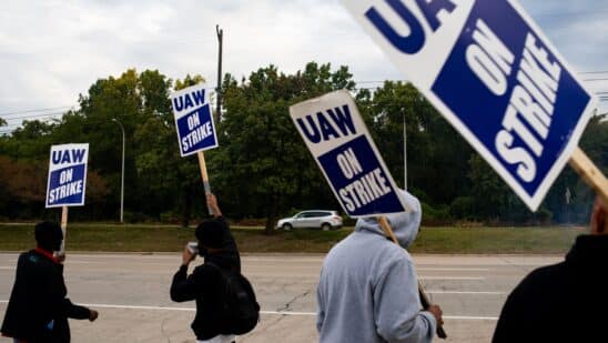 United Auto Workers (UAW) members and supporters on a picket line outside the Ford Motor Co. Michigan Assembly plant in Wayne, Michigan, US, on Wednesday, Sept. 20, 2023. The United Auto Workers said more of its members will go on strike at General Motors Co., Ford Motor Co. and Stellantis NV facilities starting at noon Friday unless substantial headway is made toward new labor contracts. Photographer: Emily Elconin/Bloomberg