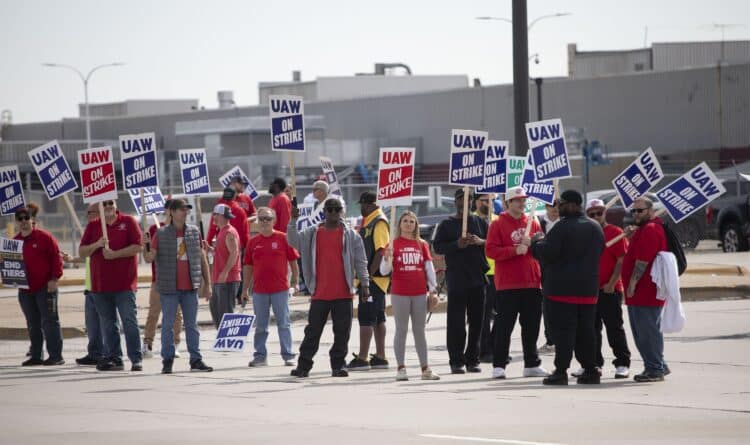 United Auto Workers members strike at the Ford Michigan Assembly Plant in Wayne, Michigan.