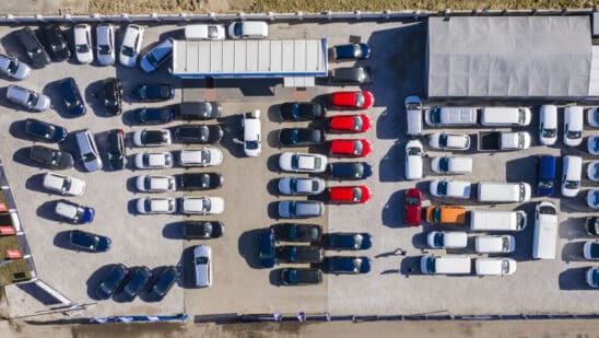 Aerial view of cars for sale on a dealer lot