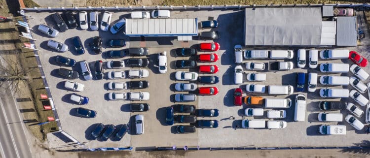 Aerial view of cars for sale on a dealer lot