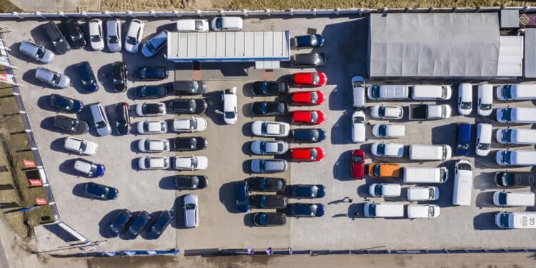 Aerial view of cars for sale on a dealer lot