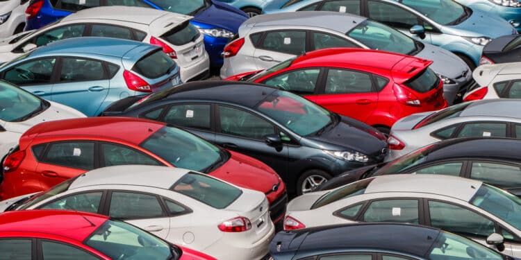 Cars in a lot waiting to be sold
