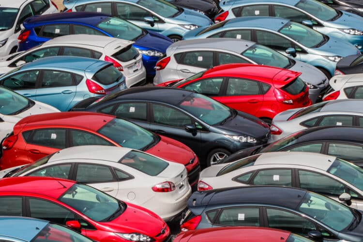 Cars in a lot waiting to be sold