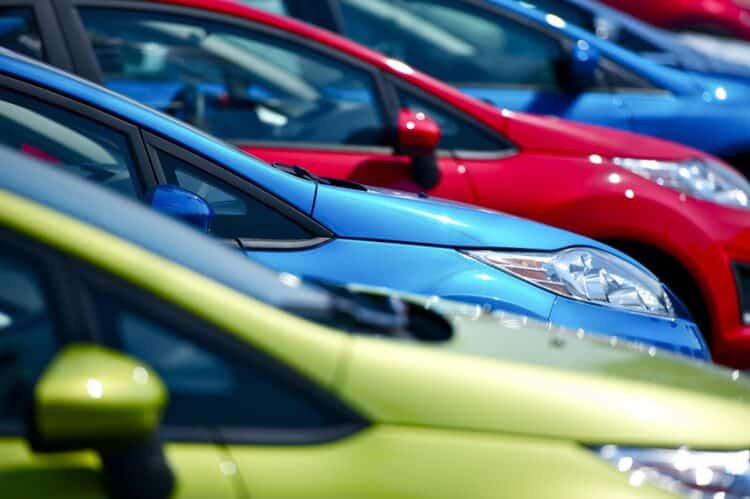 Variety of new cars ready for sale on a dealer lot