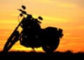 Motorcycle with a sunset behind it