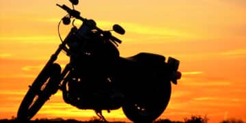 Motorcycle with a sunset behind it