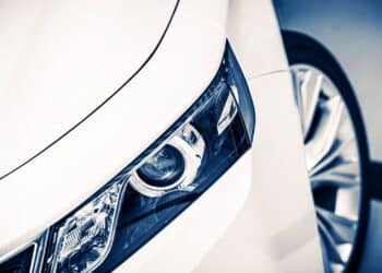 Close up of headlight on a white car