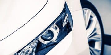 Close up of headlight on a white car