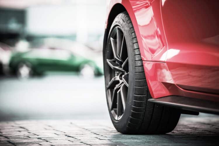 Close up of a tire on a red car