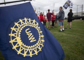 United Auto Workers members strike the General Motors Lansing Delta Assembly Plant in Lansing, Michigan.