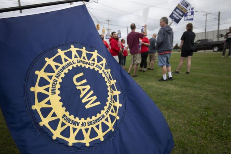 United Auto Workers members strike the General Motors Lansing Delta Assembly Plant in Lansing, Michigan.