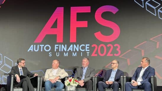 Auto Finance Summit panel execs on stage