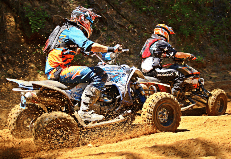 ATVs riding on dirt