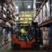 A worker uses a forklift to move a pallet at a distribution warehouse in Louisville, Kentucky.