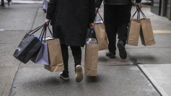 Shoppers carry bags in New York.
