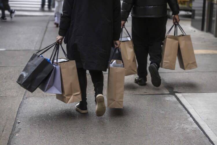 Shoppers carry bags in New York.