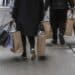 Shoppers carry bags in New York.