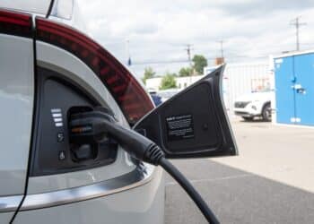 An electric vehicle is charged at a dealership in Detroit.