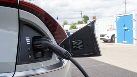 An electric vehicle is charged at a dealership in Detroit.