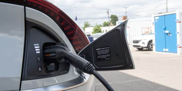 An electric vehicle is charged at a dealership in Detroit.