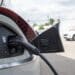 An electric vehicle is charged at a dealership in Detroit.