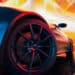 Close up of a car front tire with a red and yellow lights behind it