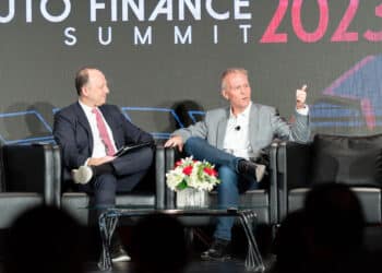 Tom Shortt on stage with JJ Hornblass at Auto Finance Summit 2023