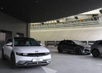 A Hyundai Motor Co. Ioniq 5 electric vehicle (EV) parked next to the rooftop test track at the Hyundai Motor Group Innovation Center Singapore in Singapore, on Tuesday, Nov. 14, 2023. Hyundai Motor Group officially opened a heavily automated facility in Singapore that it expects to play a crucial role in its electrification strategy in the coming decades, deploying robotics and new production methods.