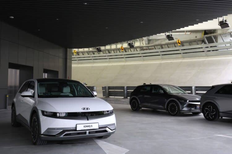 A Hyundai Motor Co. Ioniq 5 electric vehicle (EV) parked next to the rooftop test track at the Hyundai Motor Group Innovation Center Singapore in Singapore, on Tuesday, Nov. 14, 2023. Hyundai Motor Group officially opened a heavily automated facility in Singapore that it expects to play a crucial role in its electrification strategy in the coming decades, deploying robotics and new production methods.