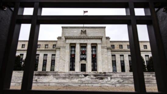 The Marriner S. Eccles Federal Reserve building in Washington, D.C., U.S., on Sunday, Dec. 19, 2021. The Federal Reserve chair has tempered his ambition to restore the labor market to its pre-pandemic strength, as the central bank confronts surging inflation and a workforce still constrained by Covid-19.