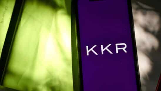 The KKR & Co. logo on a smartphone arranged in the Brooklyn borough of New York