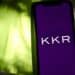 The KKR & Co. logo on a smartphone arranged in the Brooklyn borough of New York