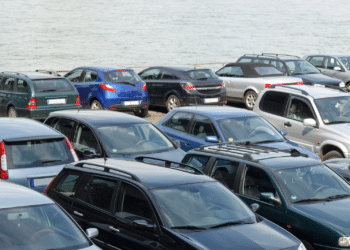 cars lined up near ocean