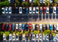 Overhead shots are cars parked along a road