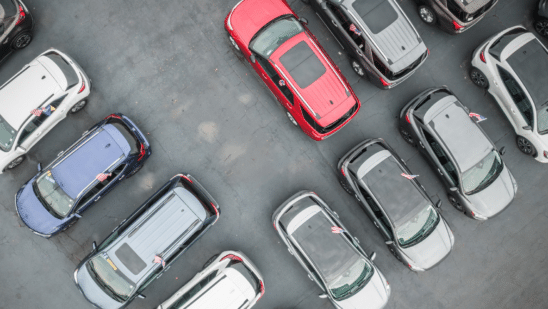 Overhead shot of cars in a dealer lot