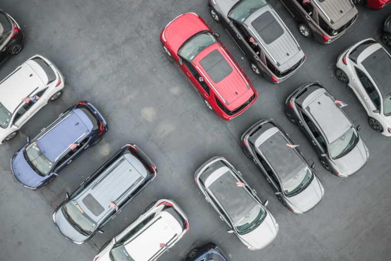 Overhead shot of cars in a dealer lot