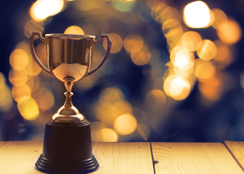 Trophy on a wooden table with blurred back lighting