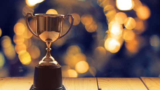 Trophy on a wooden table with blurred back lighting