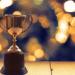 Trophy on a wooden table with blurred back lighting