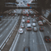 Cars on road under bridge